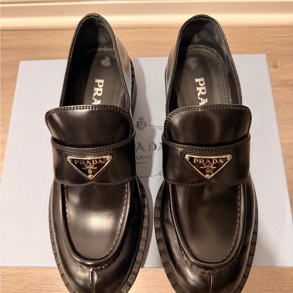 Prada Black Leather Loafers with Silver Triangle Logo